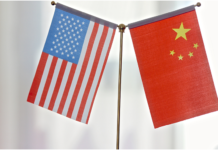 ‘He who tied the bell to the tiger must take it off’: America should show the world its sincerity The national flags of China and the U.S. /CFP