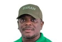 SLPP Endorses Electoral Reforms While Insisting on ECSL Independence Portrait of a man wearing a green polo shirt and a green cap with the word PARAN, facing the camera.