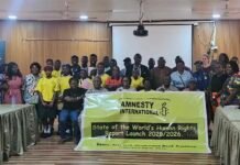 Sierra Leone’s Human Rights Crisis Rooted in Weak Systems, Not Laws – AISL Report Group of diverse people posing in a room with an Amnesty International banner for the State of the Worldb4s Human Rights Report Launch 2025/2026Reader-friendly version.