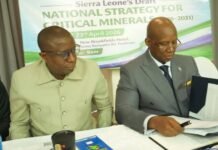 Mines Ministry Leads High-Level Talks to Shape 2026–2031 Critical Minerals Roadmap Two officials sign documents at a conference table with a banner for Sierra Leone's National Strategy for Critical Minerals in the background.