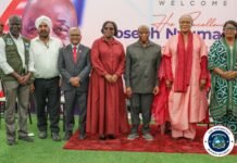 President Boakai Applauds Industrial Investment… Sethi Group Expands Regional Footprint with New Steel Plant in Sierra Leone and Phase II Launch in Liberia Group of seven dignitaries posing on a red carpet at a welcome event, with a banner and the Liberian presidential seal visible.
