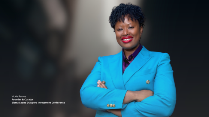 Portrait of Vickie Remoe, Founder & Curator of the Sierra Leone Diaspora Investment Conference, smiling in a bright blue blazer with arms crossed.