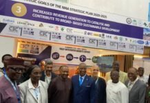 CTC Mining Strengthens Commitment to Responsible Mining at Sierra Leone Mining Week 2026 Group of officials posing in front of a trade show booth promoting the NMA Strategic Plan 2020–2025