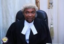 Magistrate Hadiru Daboh Remands 28-Year-Old Man Over Alleged Rape of Mentally Unstable Woman Judge seated in a courtroom, wearing a black robe with white neck bands and a serious expression.