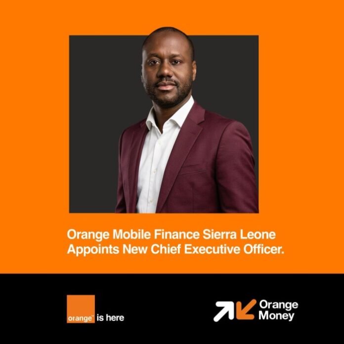 Portrait of a man in a burgundy suit against an orange background; caption: 'Orange Mobile Finance Sierra Leone appoints New Chief Executive Officer'