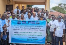 SLRSA Strengthens Nationwide Road Safety Drive as Over 2,000 Crashes Recorded Group photo of diverse attendees posing outdoors behind a banner for the Sierra Leone Road Safety Authority stakeholder engagement on accelerating road safety action in Port Loko.