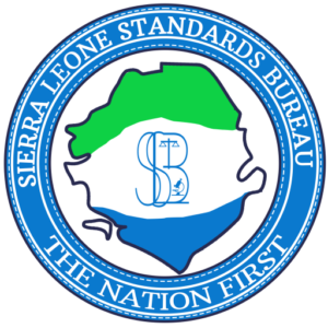 Circular logo for the Sierra Leone Standards Bureau featuring a stylized green–white–blue map, central emblem, and the motto 'The Nation First' around the edge.