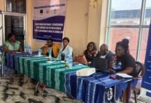 WEP Sierra Leone, EU Conclude One-Day Consultation on Women’s and Children’s Rights Panel of six people seated at a long table with blue and green tablecloths, presenting at a workshop in a room with a banner in the background.