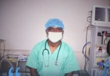 Dr. Sheku Dennis Massaquoi Earns Global Recognition for Advancing Surgical Care in Sierra Leone Surgeon in scrubs and mask in an operating room; blue overlay with the quote about a resilient, innovative surgical system and SURG hub logo.