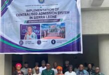 MTHE Engages Stakeholders on Centralized Admissions System to Reform University Entry Process Group photo of officials and delegates standing in front of a banner for the Centralised Admission System in Sierra Leone.