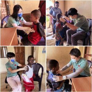 | The Calabash Newspaper Nurse wearing a mask and gloves checks a young boy’s chest with a stethoscope in a small clinic corner.