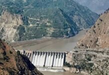 Rebuttal to “Sifting IWT Truth from Lies, Myths”(An Indian Perspective – Response to Brig (retd) Dr Raashid Wali Janjua’s letter published in Dawn, April 9, 2026) A concrete dam in a rocky canyon with a river flowing past and mountains in the background