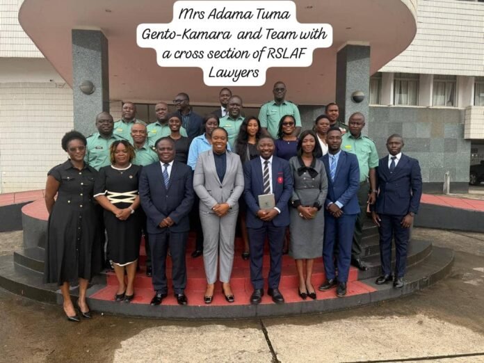 Group of lawyers and officials posing on building steps; speech bubble reads 'Mrs Adama Tuma Gento-Kamara and Team with a cross section of RSLAF Lawyers'.