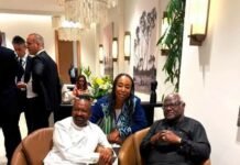 Vice President, Former President Koroma and ICPNC Executive Secretary Showcase Sierra Leone’s Commitment to Peace Three adults seated in brown chairs at a lounge, with snacks and orange juice on a small table nearby.