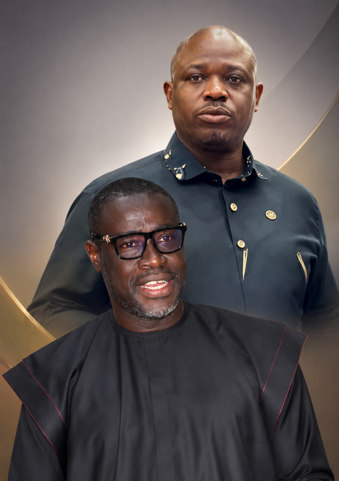 Two men posing for a formal portrait: a front-facing man in a black traditional outfit with glasses, and a taller man behind him in a dark blue uniform with gold pins.