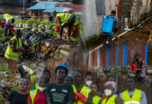 Caritas Freetown Leads Community Clean-Up and Fumigation Drive in Coastal Communities Group of volunteers in bright safety vests and red gloves cleaning a trash-filled canal, with more workers in the background.