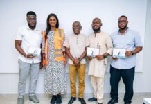 SLCAA Strengthens Aviation Safety as Three Inspectors Return from Specialist Training Group of five adults posing with certificates; one woman wears an orange safety vest in a professional setting, logo visible bottom-left.