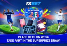 WORLD WIN 26 from 1xBet: unlock football roles and win super prizes! Promo banner for 1xBet World Cup 26, with two soccer players, colorful confetti, and devices (phones/tablets)—text invites bets for the super prize draw.