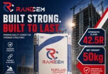 FAWAZ RANDCEM Cement Promotes Quality and Safer Construction Practices Nationwide Promotional poster for Randcem Portland cement showing a 50 kg cement bag, bold slogan 'Built Strong. Built to Last.', with a construction site backdrop and strength class 42.5R.