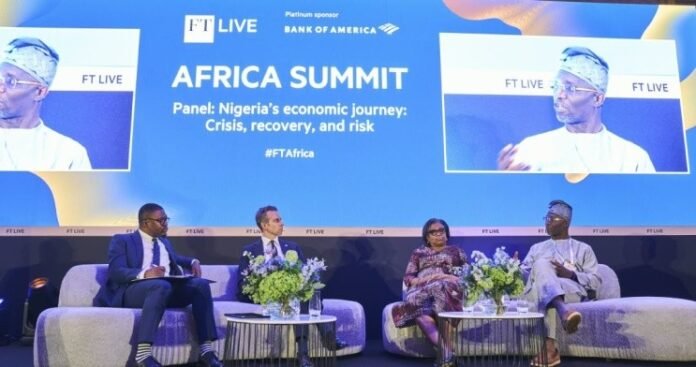 Four panelists seated on a stage with a blue backdrop reading 'AFRICA SUMMIT' and 'Panel: Nigeria's economic journey: Crisis, recovery, and risk' at FT Live.