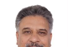India and Africa: Relations Beyond Rhetorics Portrait of a smiling middle-aged man with gray hair and a mustache wearing a dark jacket.