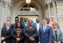 Columbia University Masterclass Equips Sierra Leone Ministers with Government Delivery Skills Group of diverse professionals in business attire posing on the steps outside the Joseph L. Mailman School of Public Health building.