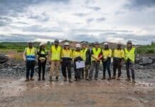 NMA to Host Sierra Leone’s First PanAfGeo Training on Geohazards, Mine Management Group of construction workers in neon vests and hard hats standing in a rocky quarry.
