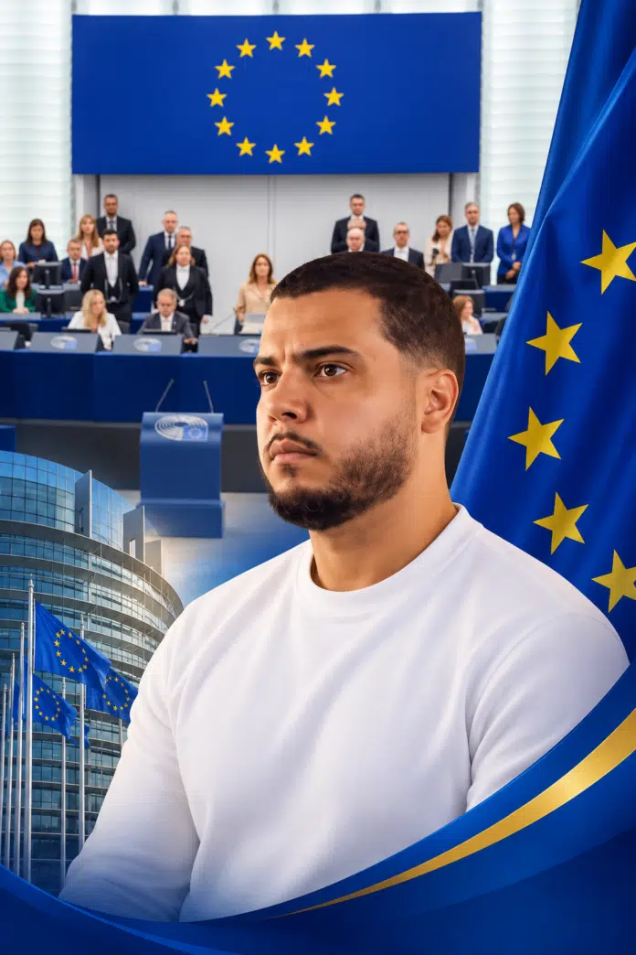 Man in a white shirt in front of a European Parliament setting with EU flag imagery and a circular group of stars behind him.