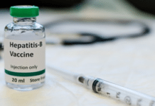 Health Ministry to Introduce Hepatitis B Birth-Dose Vaccine in November 2026 Hepatitis-B vaccine vial with green cap beside a syringe on a medical table, ready for administration (Injection only).