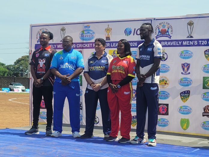 Five athletes in colorful uniforms stand on a podium in front of a sponsor banner at a cricket event.