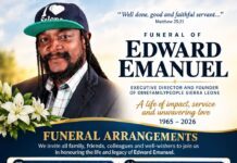As One Family People Mourns… Late Edward Emmanuel Leaves Legacy of Service and Inclusion in Sierra Leone’s Disability Movement Portrait of Edward Emanuel for a funeral program with flowers and bold 'Funeral Arrangements' text on a blue-gold banner