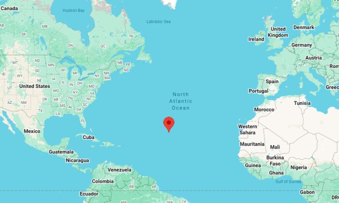 Map showing a red pin in the central North Atlantic Ocean, with North America to the west and Europe and Africa to the east.