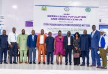Sierra Leone Begins 50-Day Countdown to Historic First Fully Digital Population and Housing Census Group of men and women in formal attire standing on a stage in front of a banner that reads '2026 Sierra Leone Population and Housing Census' and 'Every person counts, every household matters.'